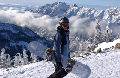 Snowboarder with mountain backdrop