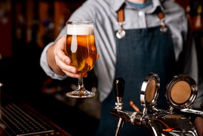 Bartender serving a beer